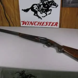 7703 winchester 23 heavy duck 12 gauge 30 inch barrel mod/mod, pistol grip with cap, solid rib,white front bead, decelerator pad 14 3/8 lop, aaa++fancy figured walnut, ejectors,single select trigger,heavy duck on bottom of receiver in gold, 98% condition. 2 3/4 & 3 inch chambers,bores are brite and shiny.
