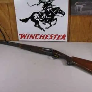 7822 winchester model 23 custom 12ga sxs, one of only 500 made in 1987 only, sst, high luster blue, with 10 chokes, choke wrench and thread clean out tool. vent rib, gold trigger, nice and tight, 27" barrels, 7lbs, nice and tight, collectors quality.