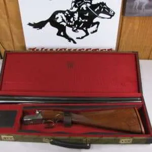 7010 winchester 23 golden quail 28 gauge 26 inch barrels ic/mod, straight grip, solid raised rib, ejectors, single select trigger, winchester pad,all original,dog/quail engraved coin silver receiver, winchester case and keys, aaa++fancy highly figured walnut. this #310 out of 500mfg. 99.9% condition