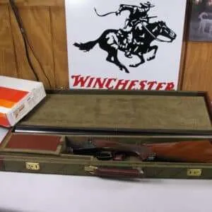 7881 winchester 23 ld light duck, also known as lady duck, 20ga, sxs, 28" barrel, solid rib, white bead front and mid sight, very nice checkered walnut, jeweled box lock, pistol grip, will take steel shot, moly chromium barrels, full/full, 97% condition, with a beautiful green winchester case and correct numbered box with instructions.