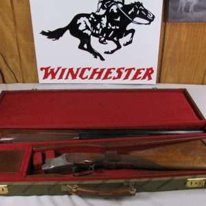 7845 winchester 101 pigeon lightweight, 28 ga, 28 inch barrels, ic/im, straight grip, with winchester green case, vent rib, quail engraved on coin silver receiver, winchester butt pad, aa+ fancy walnut, 99% condition, very hard to find in this configuration.