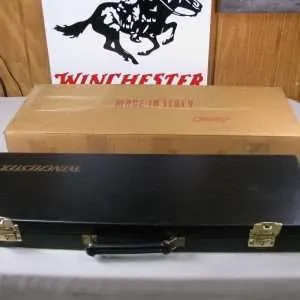 7956 winchester shotgun case with res interior, has a key and original box! will take barrels up to 27”.
