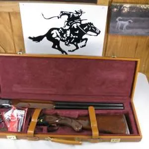 7941 winchester 101 super pigeon 12 ga, 27” barrels, 7 winchokes (sk, ic, m, im, 2 full) 2 pouches and wrench, 7 gold images, 2 gold ducks left, gold bird dog&3 gold birds right side, gold pigeon on bottom of receiver, gold "super pigeon" oval, all original 99% condition, as new, excellent condition, winchester butt pad 14 1/8 lop, fleur de lis checkered side panels and wrist, elaborate engraving on lustrous blue receiver, extra select walnut. round knob long tang,2 white beads. gold trigger. aaa++fancy walnut. these were the top of the line winchester 101's with leather case, keys, 2 snap caps