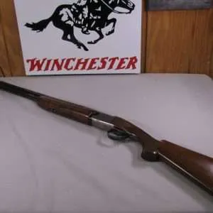 7991 winchester 101 lightweight 20 gauge, 27 inch barrels, 2 win chokes ic/mod, pheasant and quail coin engraved coin receiver, vent rib, ejectors, closes and opens tight, bores shiny, one of the best.