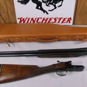 7994 winchester 21, 12 ga, vent rib, mid metal bead, bradley front bead, engine turned water table, stright grip, 26 inch barrels, 14 inch lop, closes and opens nice and tight, bores are bright and shiny. comes with a two sides leather case to hold the gun in a broken down state