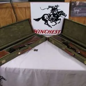 7996 winchester 23 heavy duck/light duck matching serial number set! hd is a 12 ga, 30 inch barrels in duck full/ duck full, 3” chambers, 14 ¼ inch lop ld is 20 ga, 28” barrels, 14 inch lop, full/full, 2 ¾ and 3” chambers, both have solid rib, single selective trigger, winchester pad, 99% condition, both come in beautiful green winchester hard trunk cases.